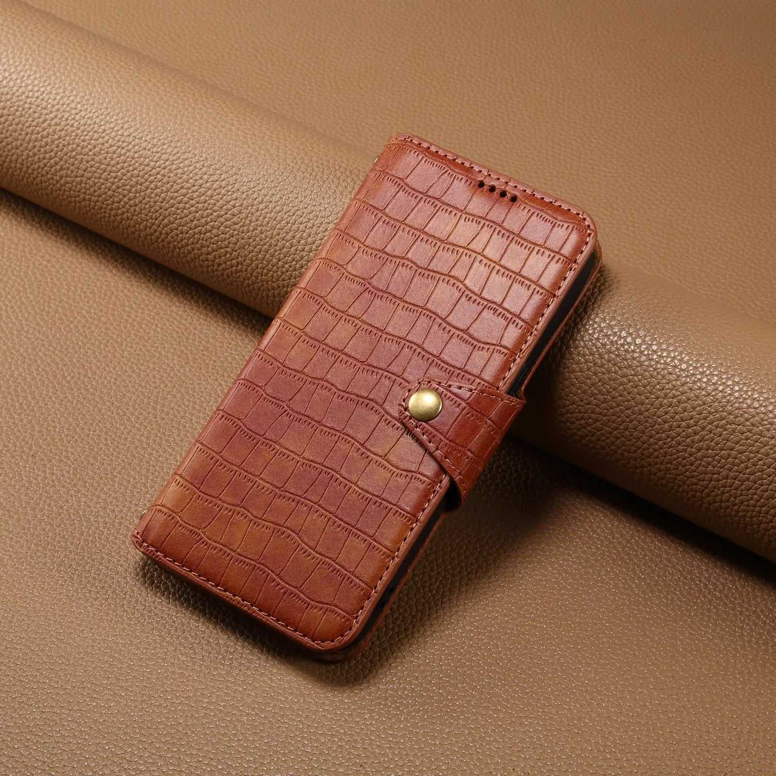 Brown leather iPhone flip case with card holder and strap by PADUCASE, featuring a sleek design and secure closure.