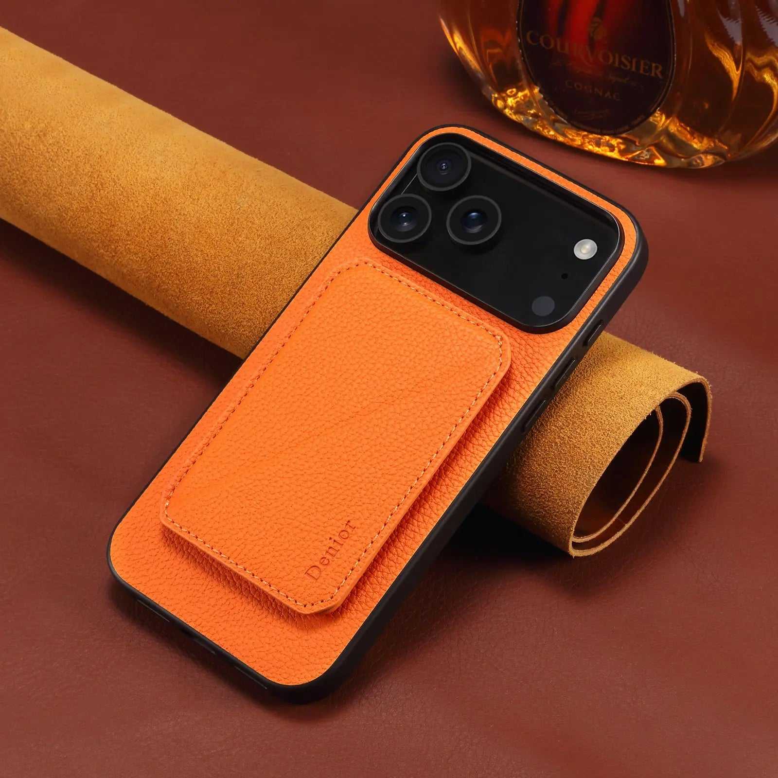 Orange leather MagSafe iPhone case by PADUCASE with hidden card slot, showcasing durable protective cover and sleek design.