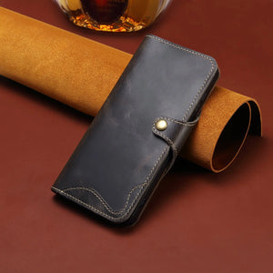 Black leather iPhone case with flip wallet design and card holder by PADUCASE, showing the front view with card slots.