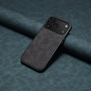 Black MagSafe leather iPhone case by PADUCASE with full protection, showing the sleek design and cutouts for charging and buttons.