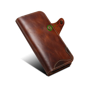 Brown leather iPhone case with card holder and strap, flip folio design by PADUCASE, showing front view with card slot and strap attachment