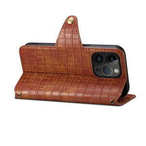 Brown leather flip iPhone case with card holder and strap by PADUCASE, showing the case's front with card slots and strap attachment.