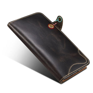 Black leather iPhone case with card holder and flip wallet design by PADUCASE, showing the front view with card slots.