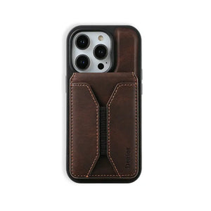 Brown leather MagSafe iPhone case with magnetic card holder by PADUCASE, shown on a smartphone with the card slot visible.