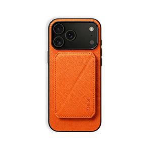 Orange leather MagSafe iPhone case with hidden card slot by PADUCASE, durable protective cover with magnetic attachment.
