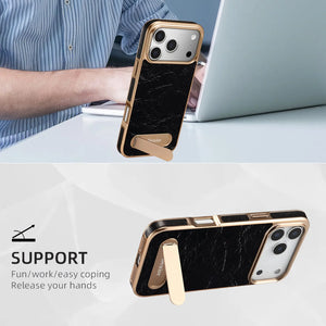 Black leather iPhone case with foldable stand and MagSafe compatibility by PADUCASE, featuring a sleek design and precise cutouts.