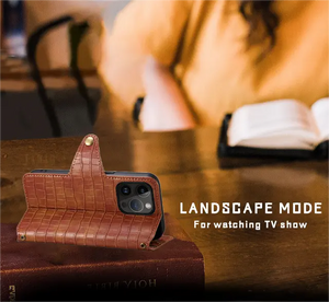 Brown leather iPhone flip case with card holder and strap by PADUCASE, showing the front view with card slots and strap attachment.