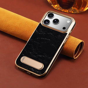 Black leather iPhone case with foldable stand and MagSafe compatibility, designed by PADUCASE for secure protection and convenience.