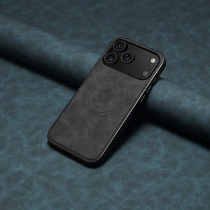 Black MagSafe leather iPhone case by PADUCASE with full protection, showing the sleek design and cutouts for charging and buttons.