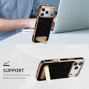 Black leather iPhone case with foldable stand and MagSafe compatibility by PADUCASE, featuring a sleek design and precise cutouts.