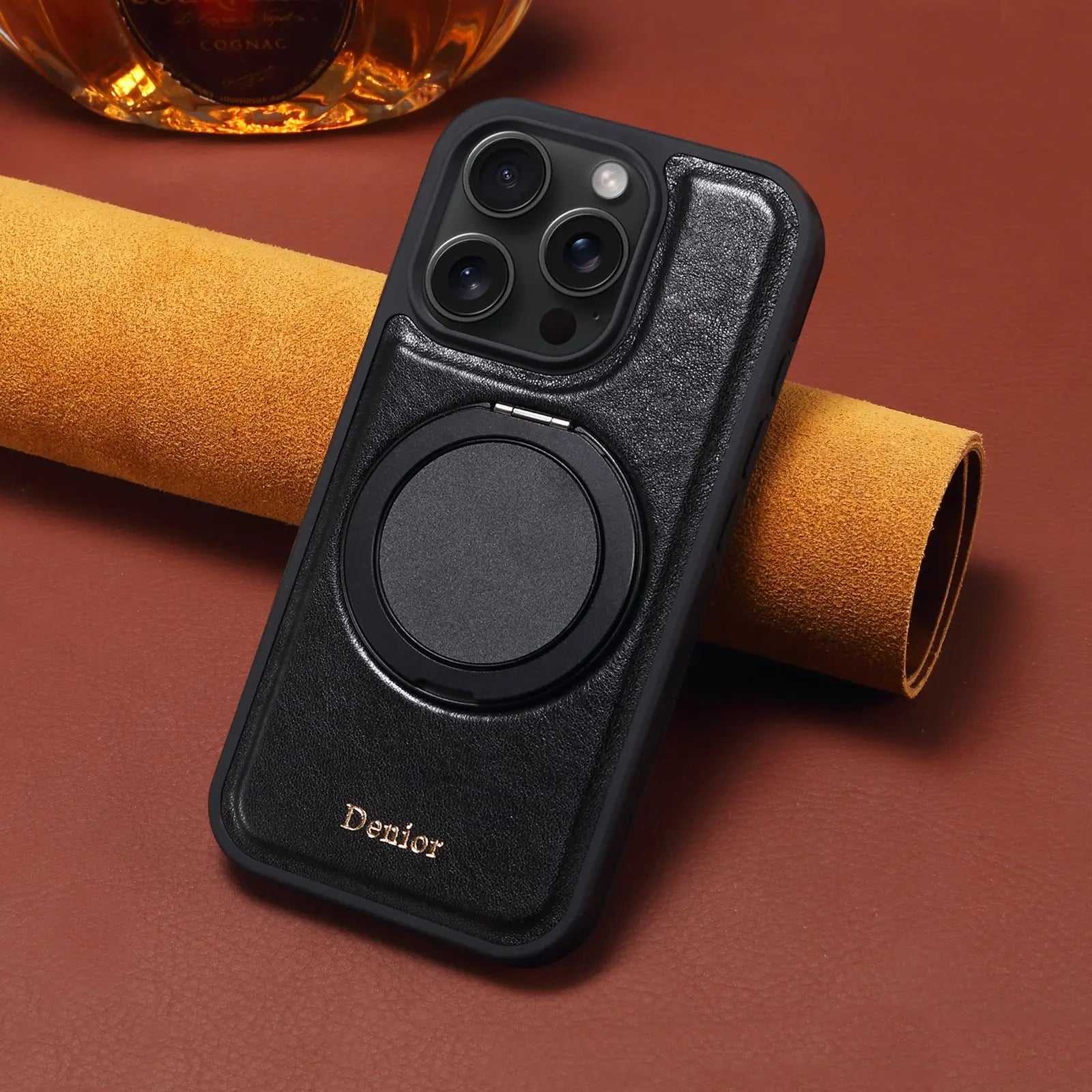 Black leather MagSafe iPhone case with built-in ring stand from PADUCASE, showcasing a sleek, slim design and secure magnetic closure.