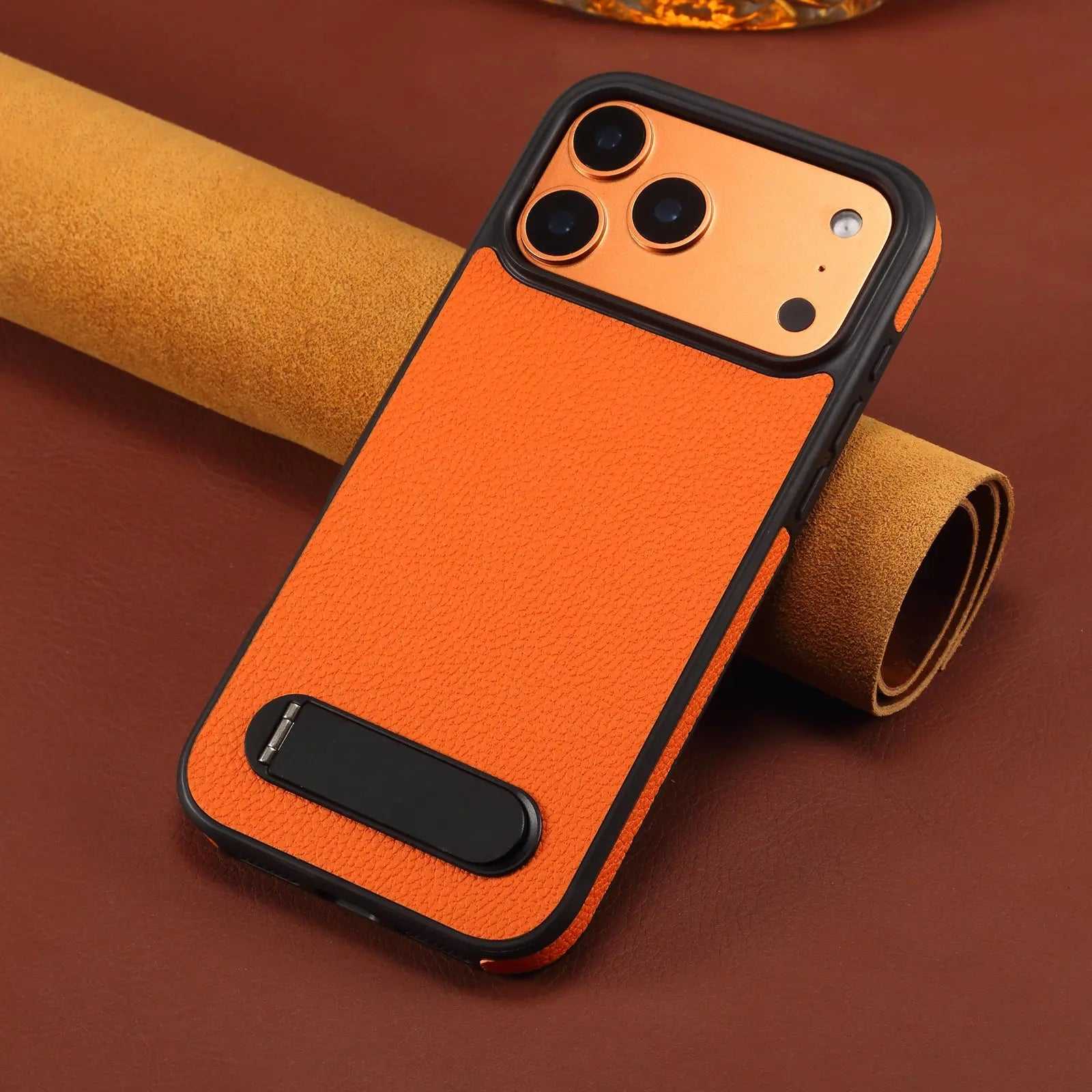 Orange leather iPhone case with built-in stand by PADUCASE, featuring durable protection and a sleek, stylish design.